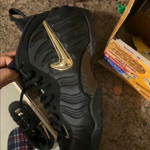 black and metallic gold foamposites